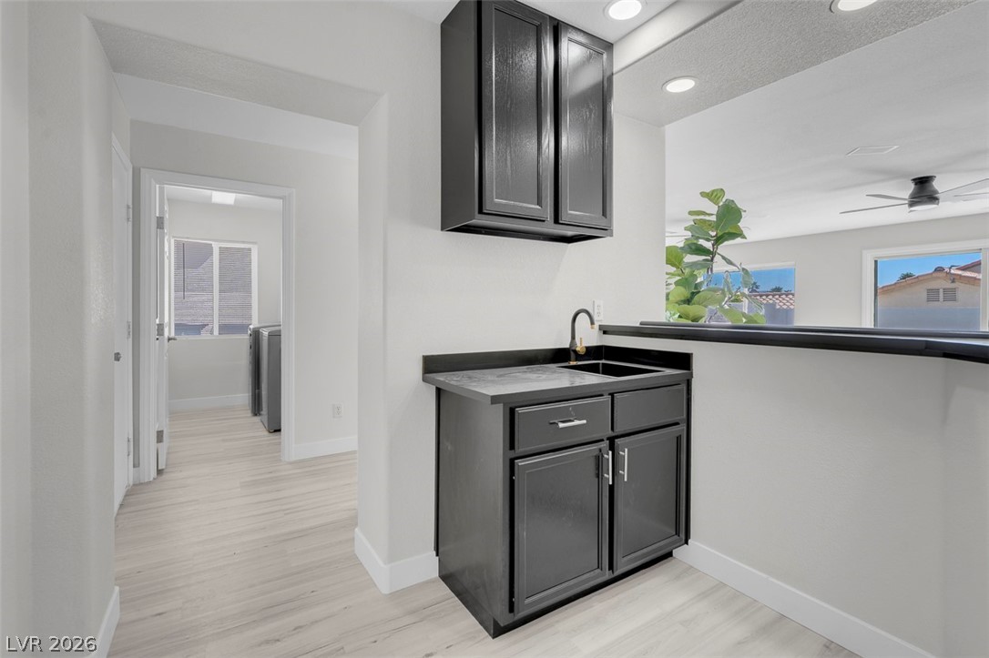 3604 North Campbell Road Las Vegas, NV 89129 - Photo 28 of 54 Bar with a sink, baseboards, light wood-style flooring, recessed lighting, and a ceiling fan