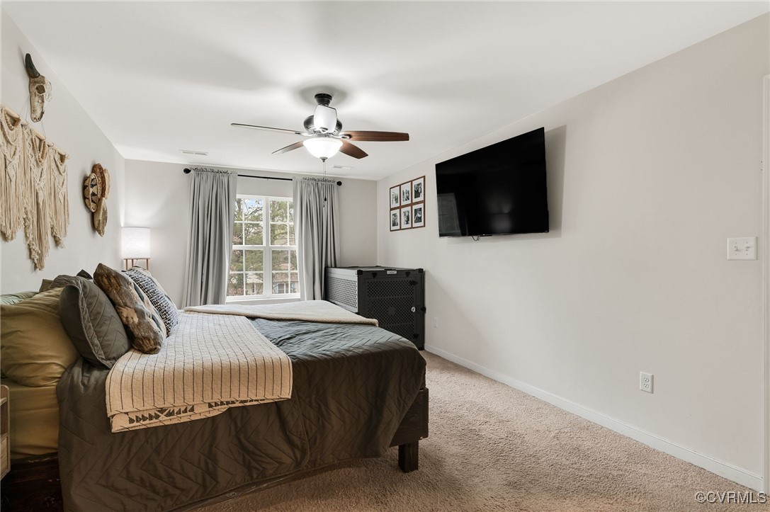 11 Haversack Road Palmyra, VA 22963 - Photo 18 of 32 a bedroom with a bed and a flat screen tv