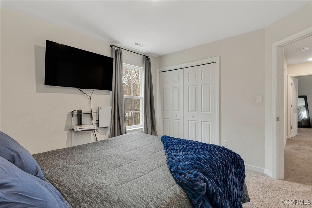11 Haversack Road Palmyra, VA 22963 - Photo 21 of 32 a bedroom with a bed and a flat screen tv
