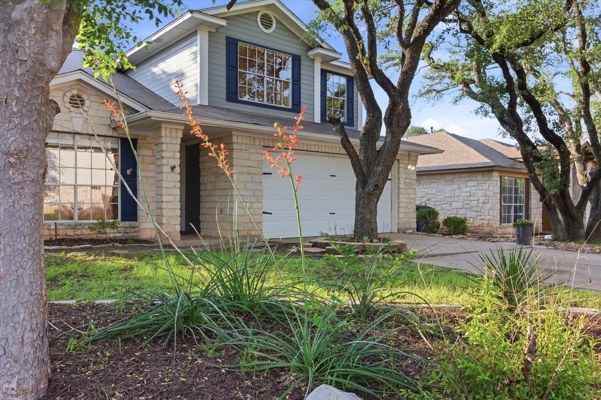 8920 West Hove Loop Austin, TX 78749 - Photo 33 of 39 Stone and siding exterior with a two-car garage