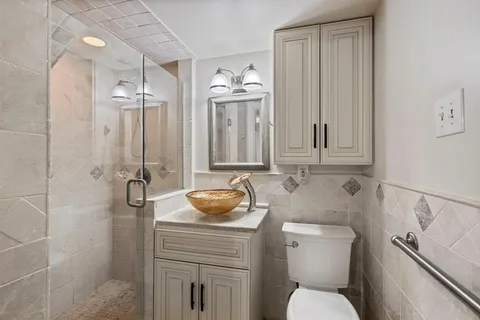 a kitchen with a sink and chandelier