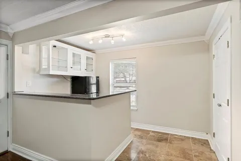 a bathroom with a sink and a window