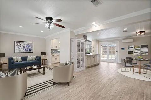 a view of a livingroom with a kitchen and entryway