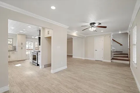 a kitchen with granite countertop a sink stainless steel appliances and cabinets
