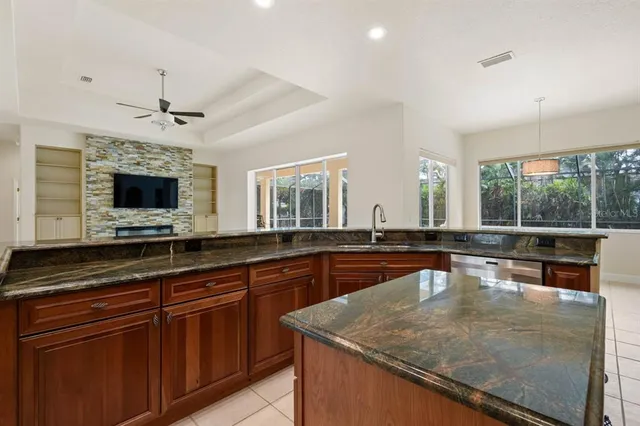 a stove top oven sitting inside of a kitchen