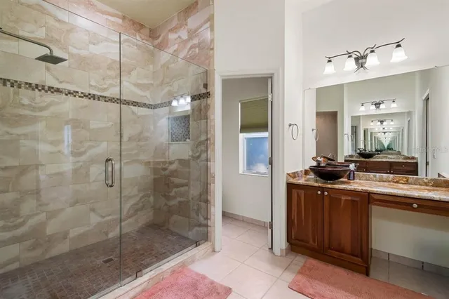 a bathroom with a granite countertop sink a toilet and bathtub