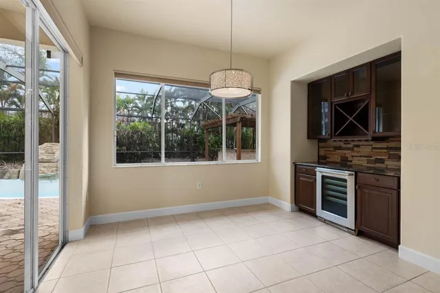 a view of an empty room with furniture and fire place