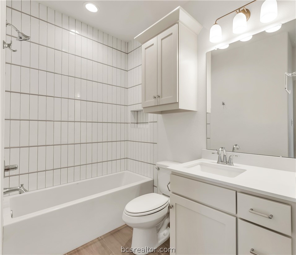 5084 Acadia Loop Bryan, TX 77802 - Photo 27 of 33 a bathroom with a sink toilet and shower