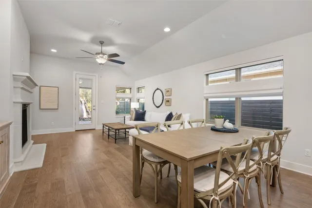 a view of a dining room with furniture and a chandelier