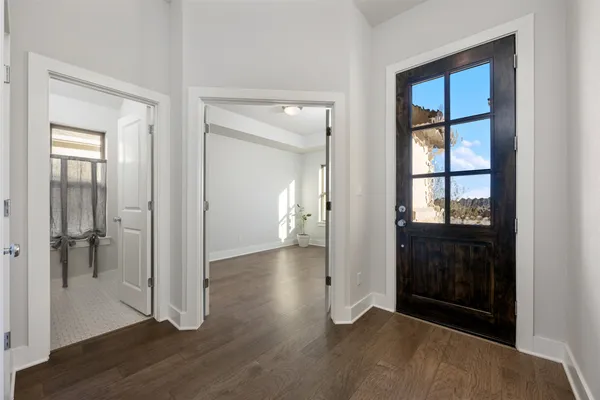 wooden floor with white walls