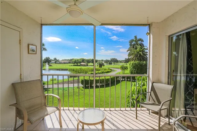 a view of a chair and tables in the balcony