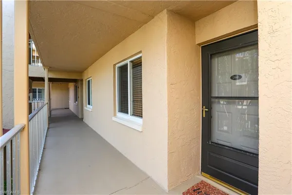 a view of hallway with bathroom