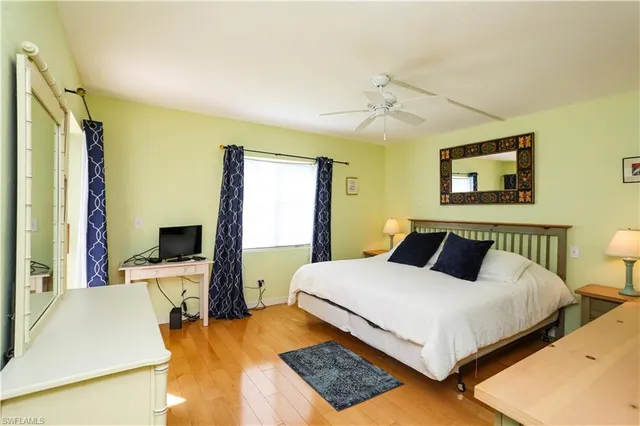 a bedroom with a bed and a desk