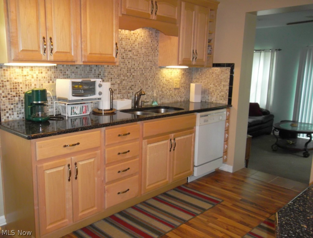 3942 Dover Road Youngstown, OH 44511 - Photo 4 of 14 Mosaic tile backsplash and under cabinet lighting add to the beauty of this updated kitchen.