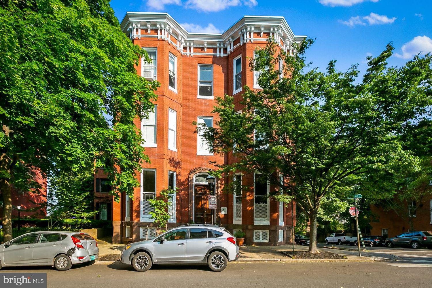 159 West Lanvale Street, Unit 5 Baltimore, MD 21201 - Photo 1 of 34 front view of a building and car parked on the roadside