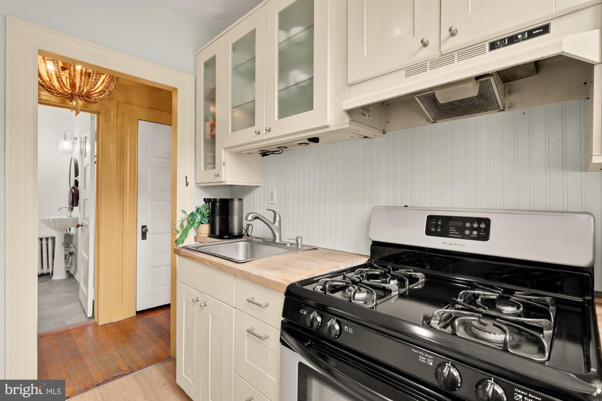 159 West Lanvale Street, Unit 5 Baltimore, MD 21201 - Photo 13 of 34 a kitchen with stainless steel appliances granite countertop a stove and a microwave