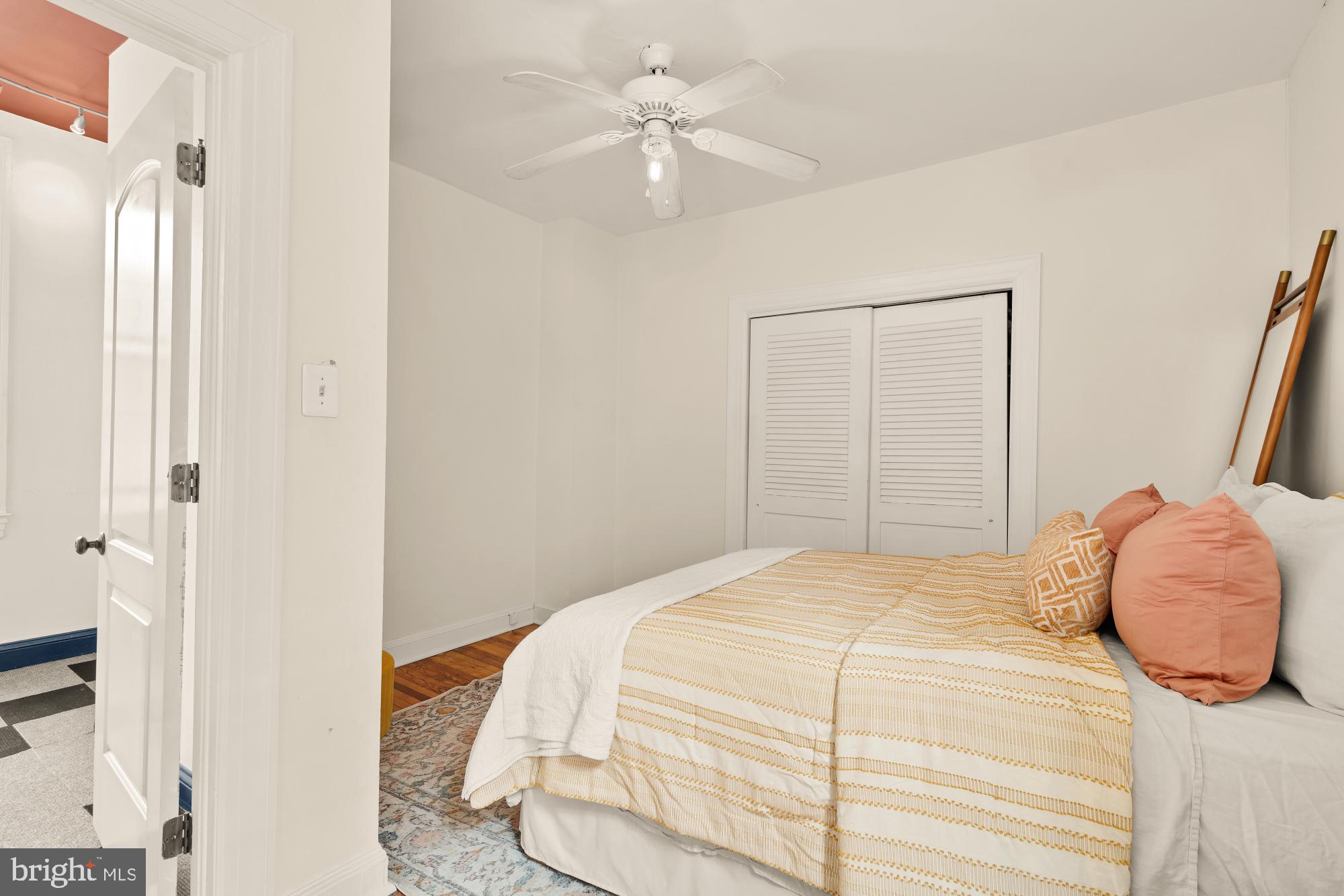 159 West Lanvale Street, Unit 5 Baltimore, MD 21201 - Photo 19 of 34 a bedroom with a bed and a chandelier