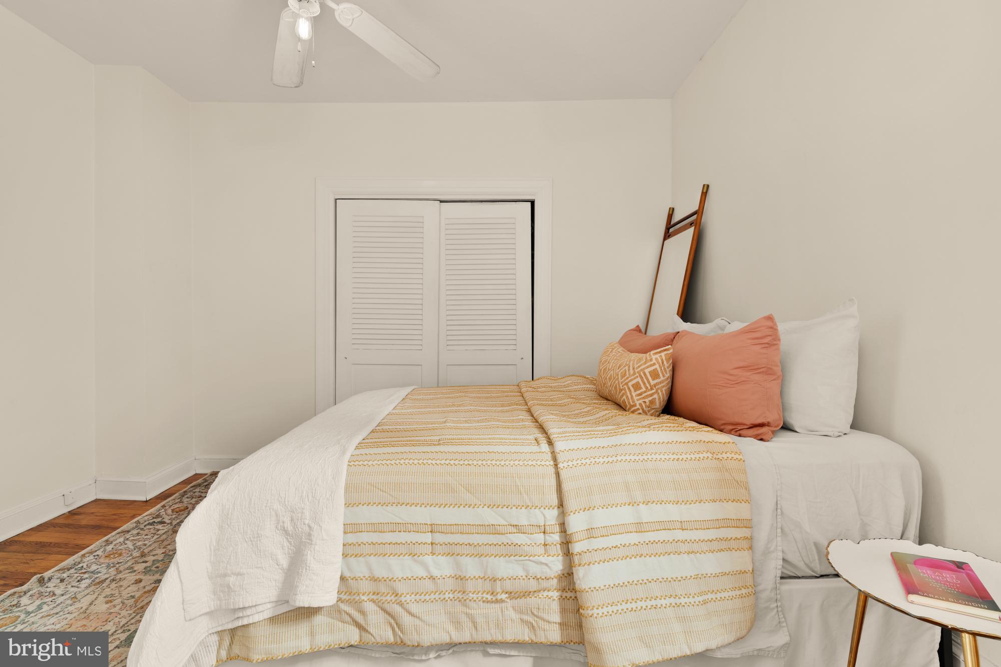 159 West Lanvale Street, Unit 5 Baltimore, MD 21201 - Photo 20 of 34 a bedroom with a bed and chair