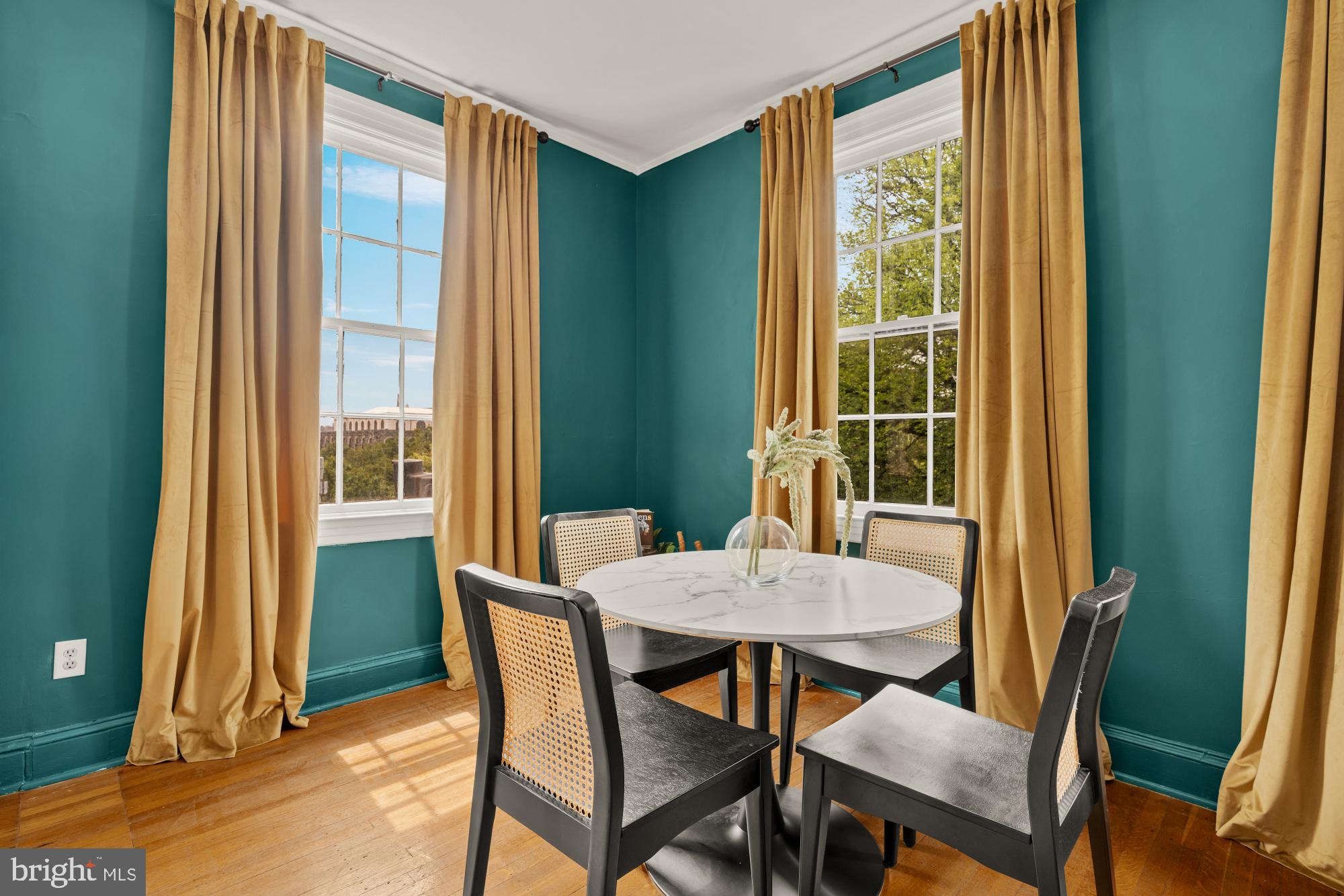 159 West Lanvale Street, Unit 5 Baltimore, MD 21201 - Photo 8 of 34 a view of a dining room with furniture and a window
