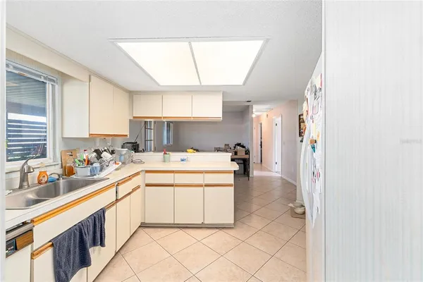 a kitchen with a sink and cabinets