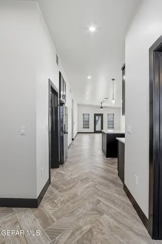 a kitchen with stainless steel appliances a stove sink refrigerator and microwave