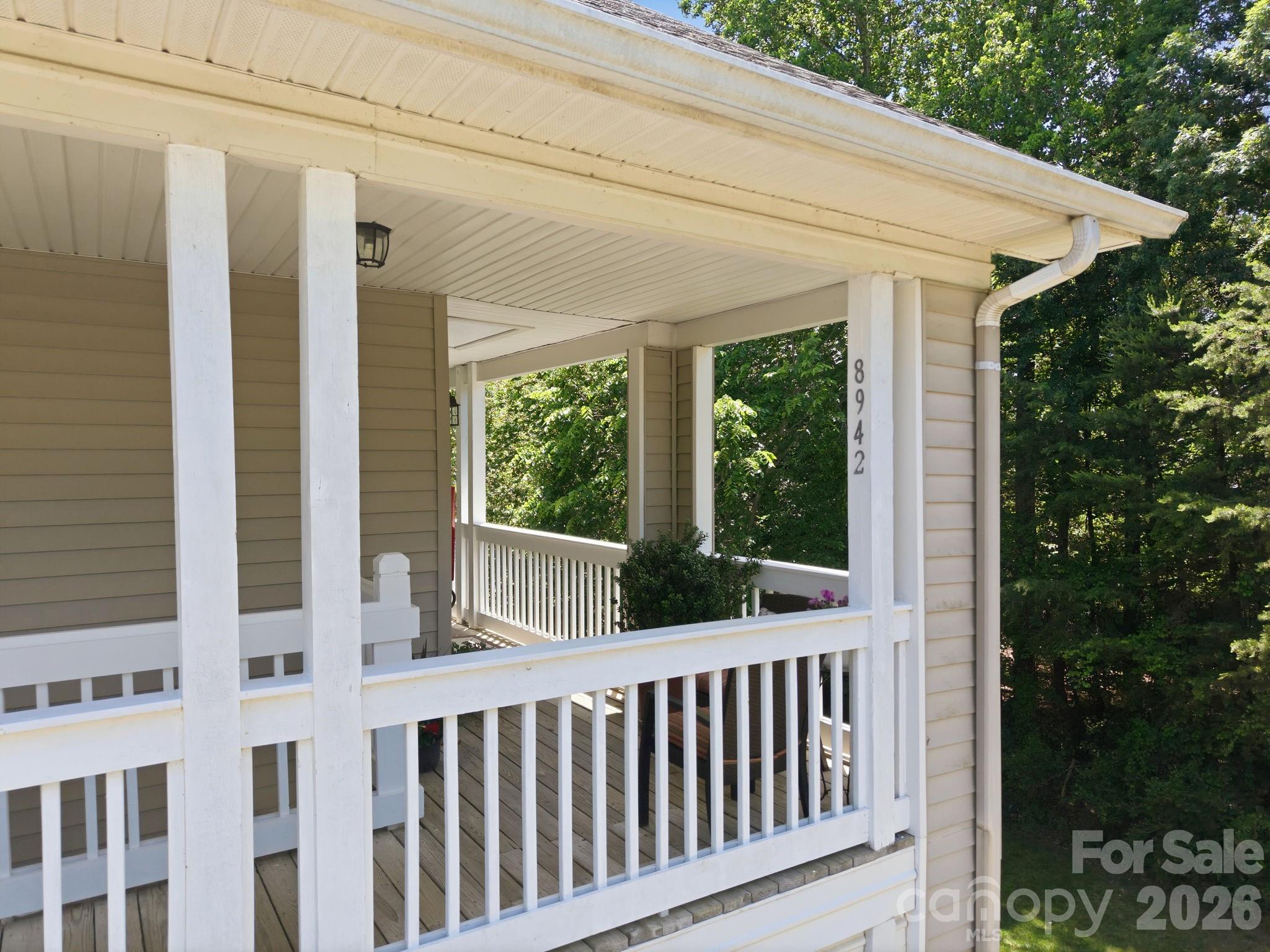 8942 Rosalyn Glen Road Cornelius, NC 28031 - Photo 34 of 47 a view of a porch with wooden floor and outdoor space