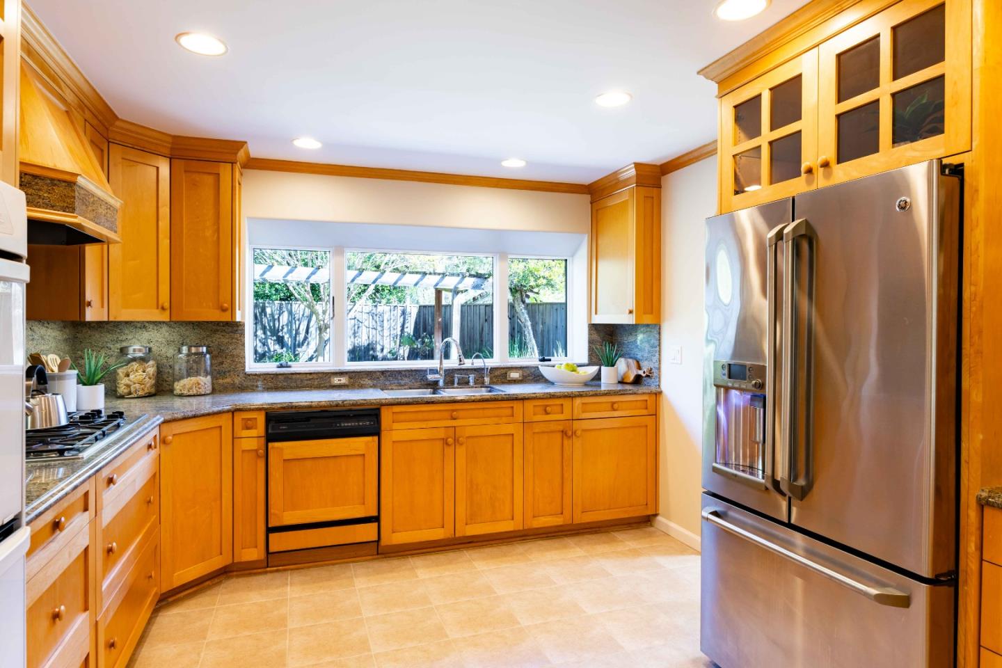 3241 Greer Road Palo Alto, CA 94303 - Photo 11 of 26 a kitchen with stainless steel appliances granite countertop a refrigerator and a sink