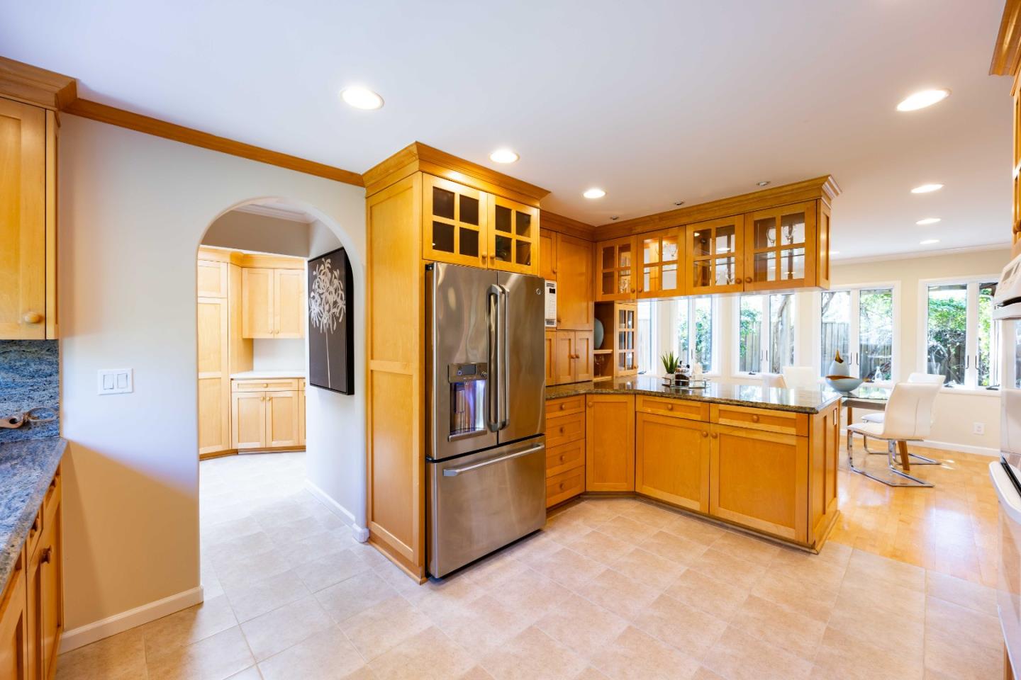 3241 Greer Road Palo Alto, CA 94303 - Photo 12 of 26 a kitchen with stainless steel appliances granite countertop a refrigerator and a sink