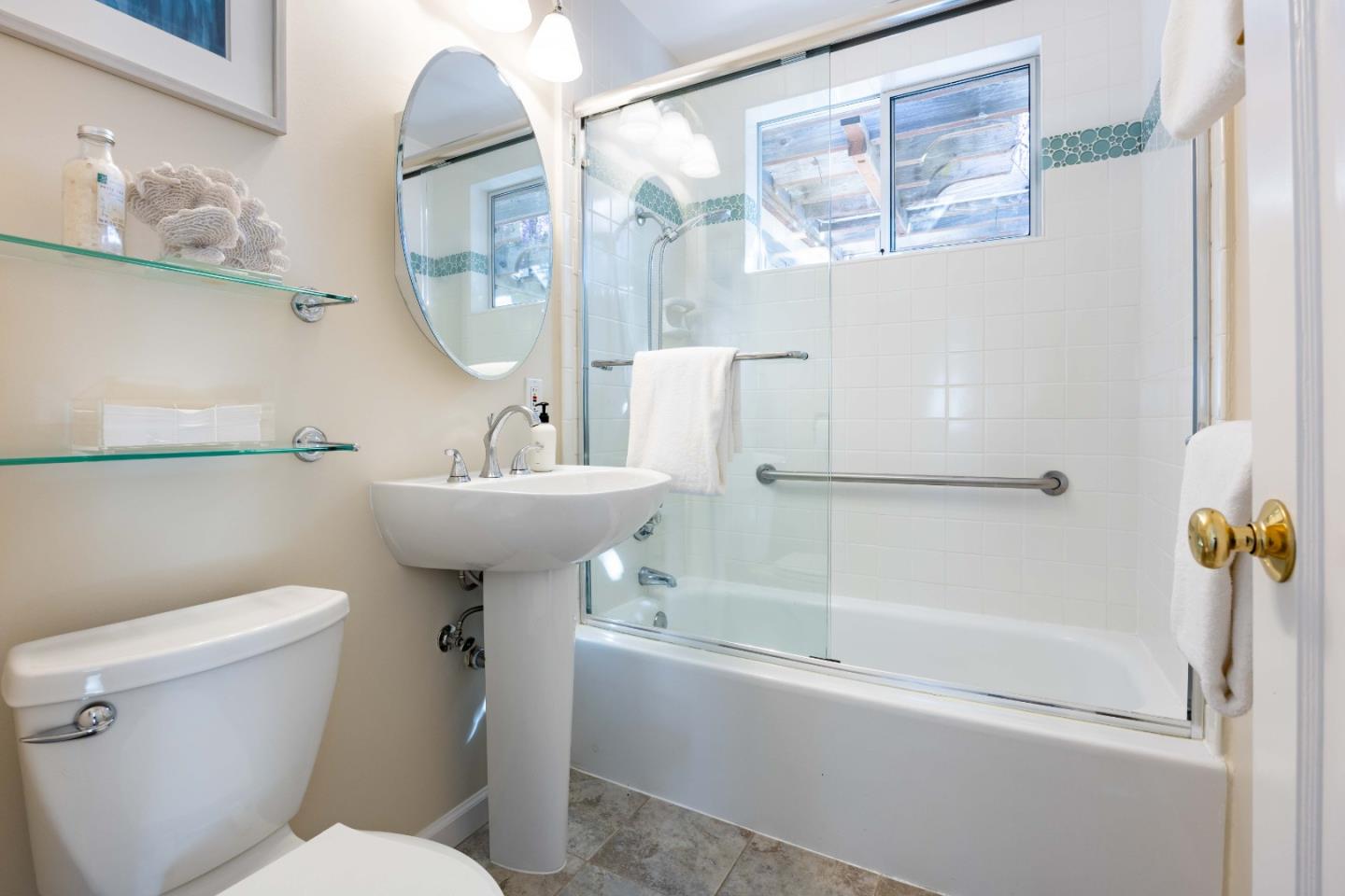 3241 Greer Road Palo Alto, CA 94303 - Photo 18 of 26 a bathroom with a sink mirror bathtub and toilet