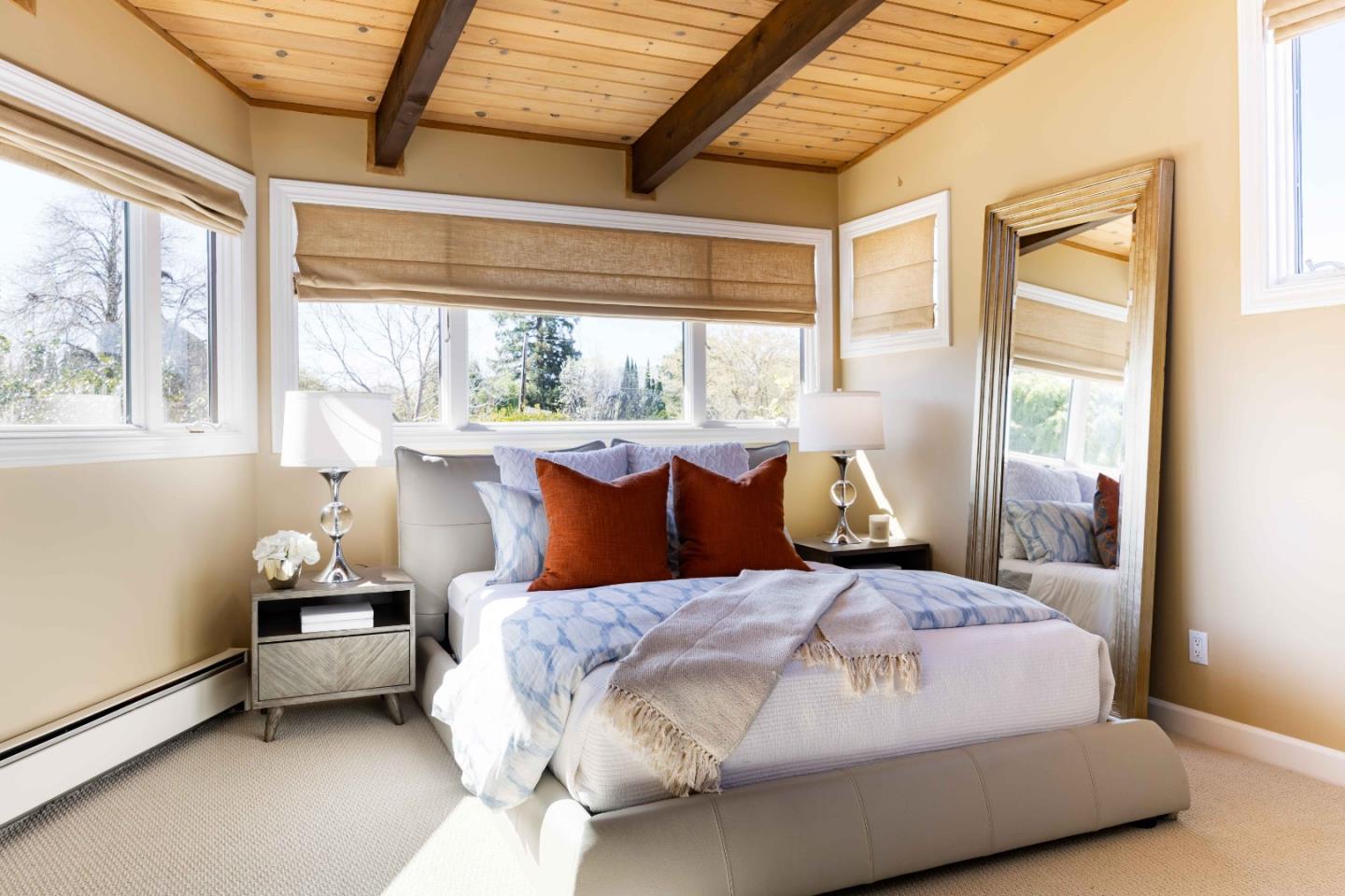 3241 Greer Road Palo Alto, CA 94303 - Photo 20 of 26 a bedroom with a bed and wooden floor