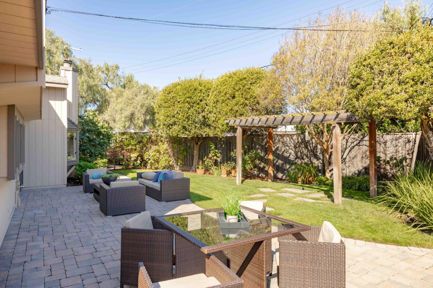 3241 Greer Road Palo Alto, CA 94303 - Photo 23 of 26 a view of a patio with couches table and chairs and potted plants