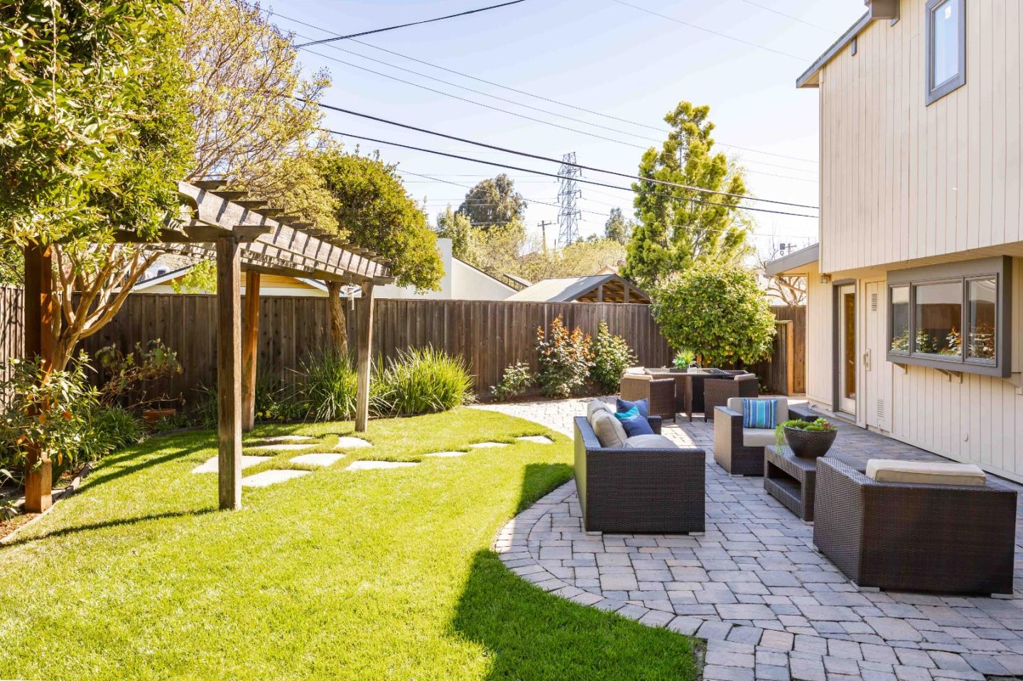 3241 Greer Road Palo Alto, CA 94303 - Photo 24 of 26 a building view with a sitting space and garden