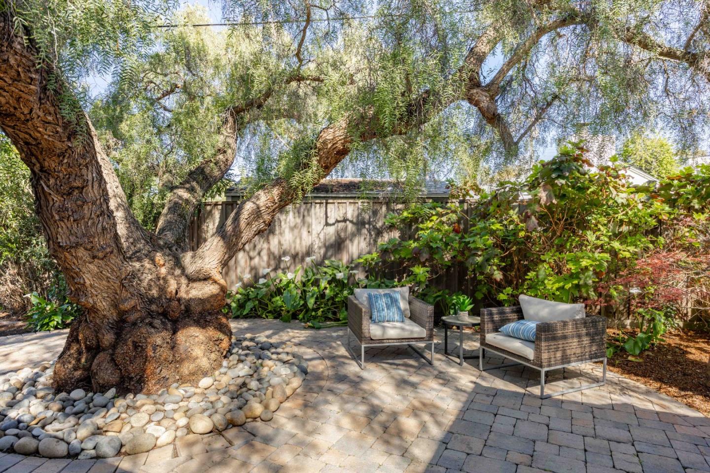3241 Greer Road Palo Alto, CA 94303 - Photo 25 of 26 a chair and table in a backyard