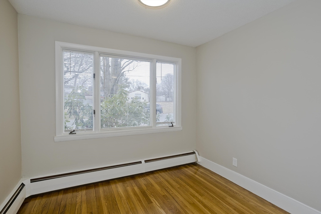 177 Marion Street Chicopee, MA 01013 - Photo 25 of 36 a view of a room with wooden floor and a window