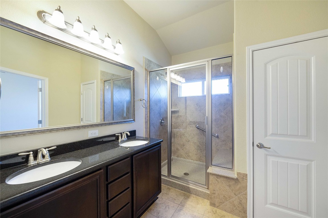 13720 Loleta Way Austin, TX 78717 - Photo 18 of 29 a bathroom with a double vanity sink and mirror
