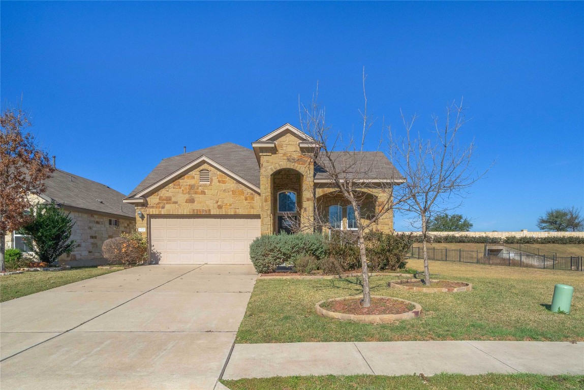 13720 Loleta Way Austin, TX 78717 - Photo 2 of 29 a front view of a house with a yard