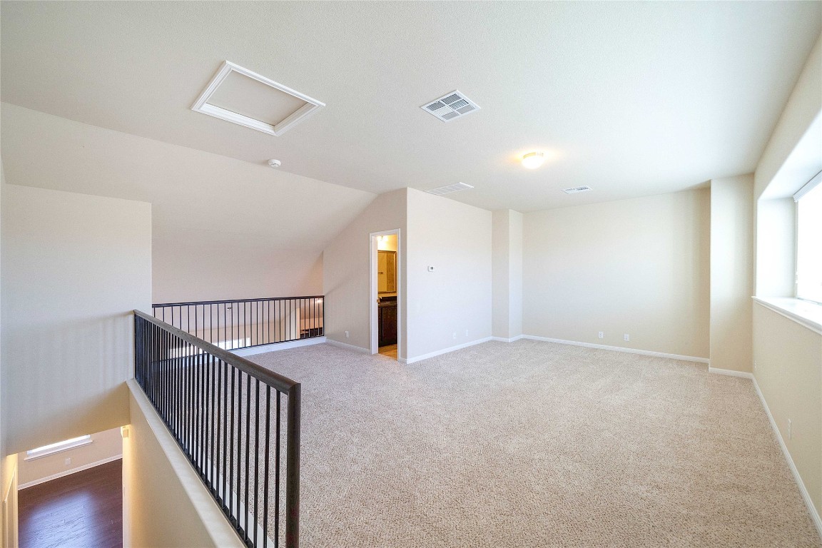 13720 Loleta Way Austin, TX 78717 - Photo 27 of 29 a view of an empty room with stairs