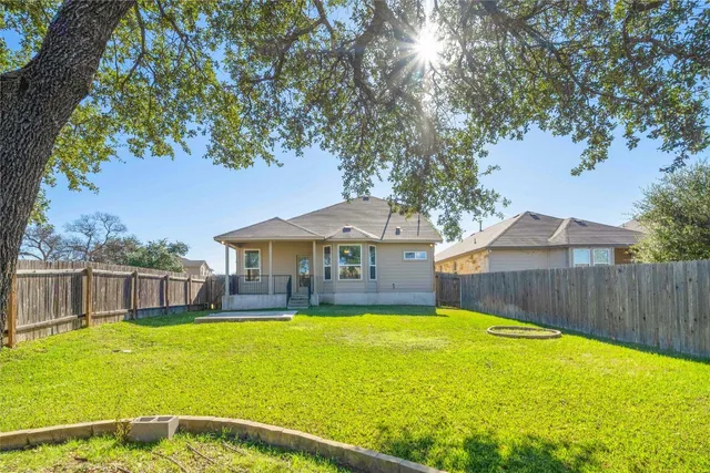 a house view with swimming pool in front of it