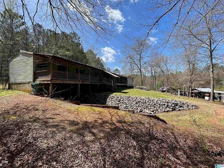163 County Road 216 Delta, AL 36258 - Photo 1 of 1 a view of a house with a yard covered in snow