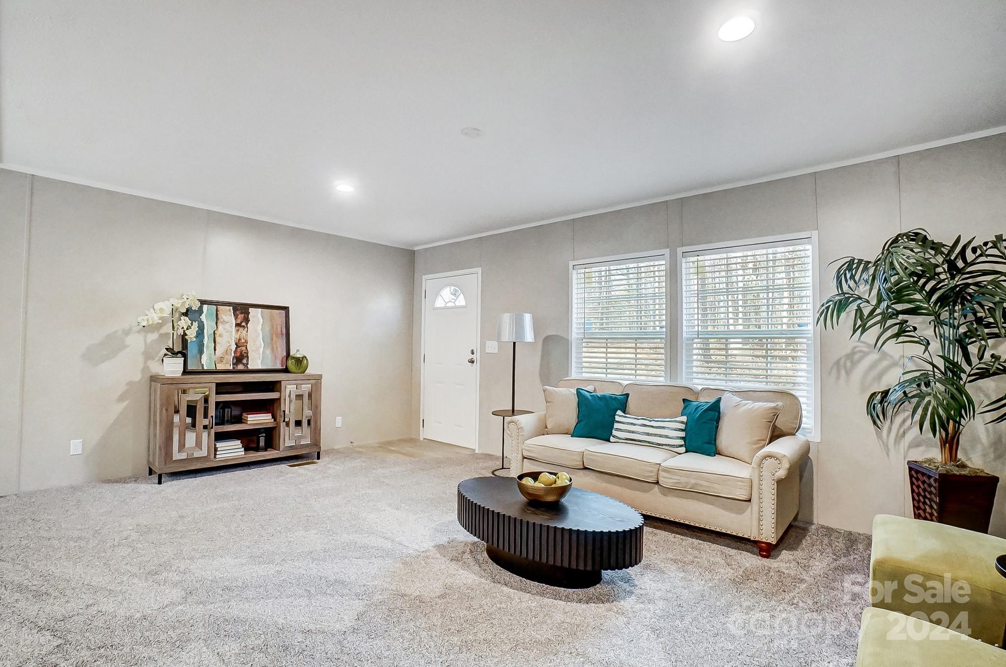 1860 Bascom Lane Midland, NC 28107 - Photo 11 of 27 a living room with furniture and a flat screen tv