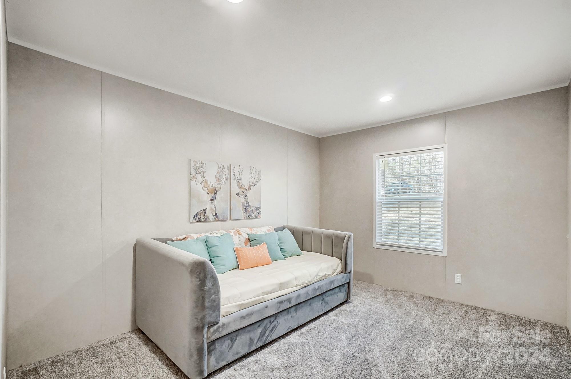1860 Bascom Lane Midland, NC 28107 - Photo 19 of 27 a living room with furniture and a window