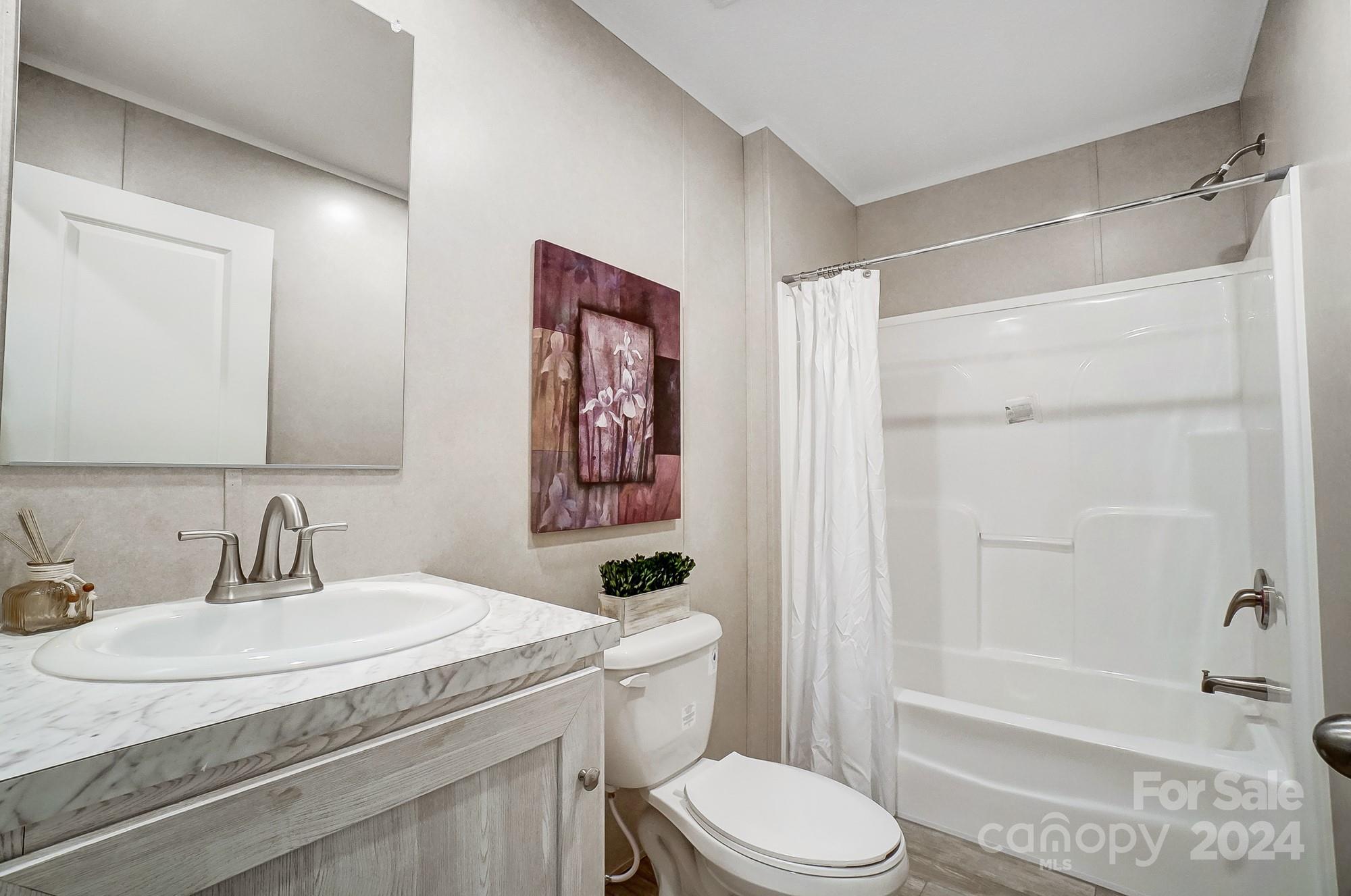 1860 Bascom Lane Midland, NC 28107 - Photo 20 of 27 a bathroom with a sink toilet and shower