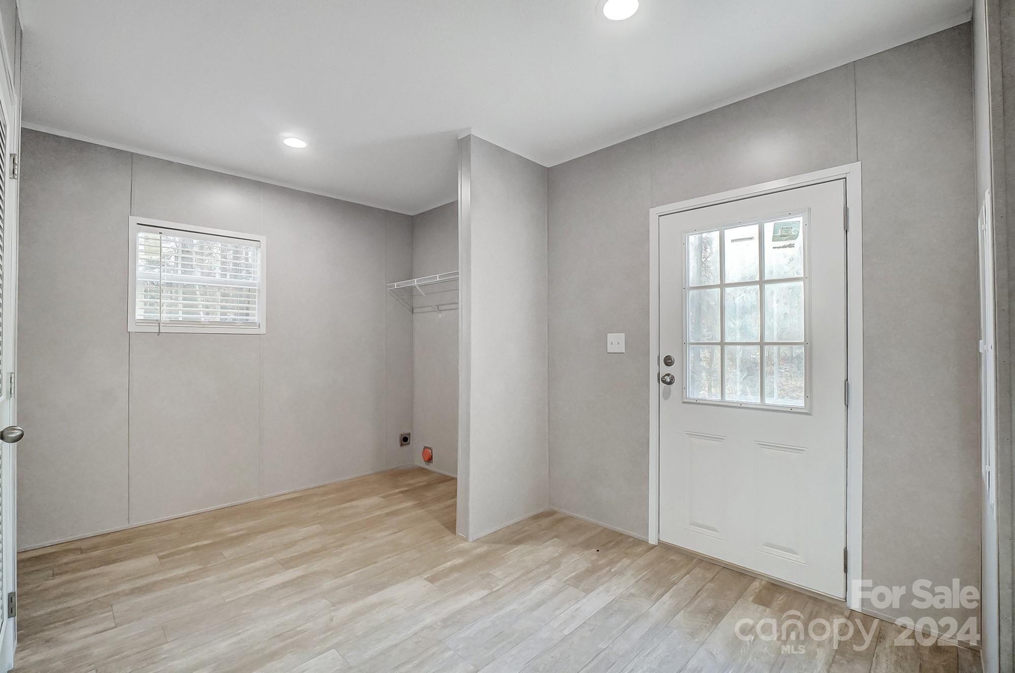 1860 Bascom Lane Midland, NC 28107 - Photo 21 of 27 an empty room with wooden floor and windows