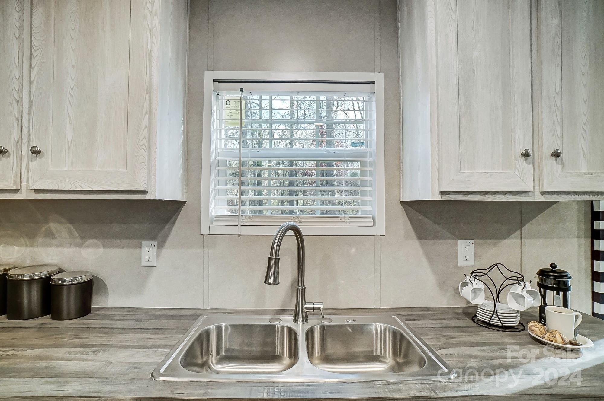 1860 Bascom Lane Midland, NC 28107 - Photo 6 of 27 a kitchen with a sink and cabinets
