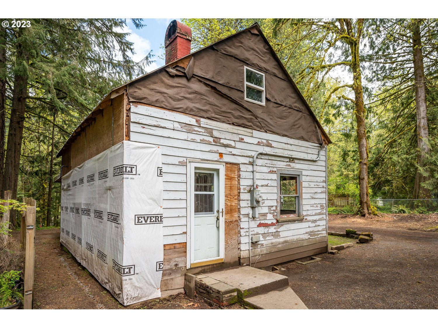 59191 Southeast Chalet Place Sandy, OR 97055 - Photo 21 of 25 a view of a house with a yard