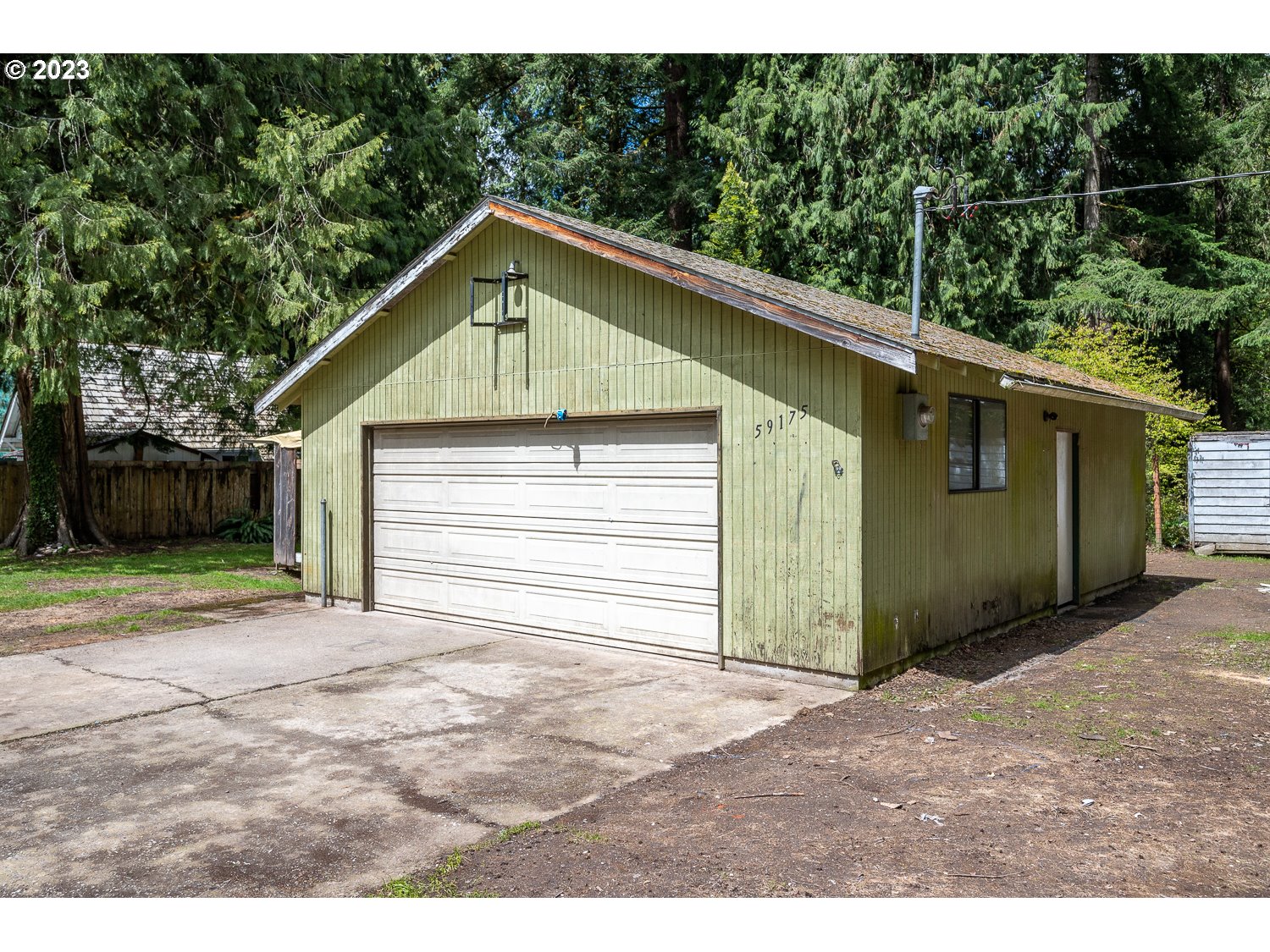 59191 Southeast Chalet Place Sandy, OR 97055 - Photo 22 of 25 a view of a house with a yard