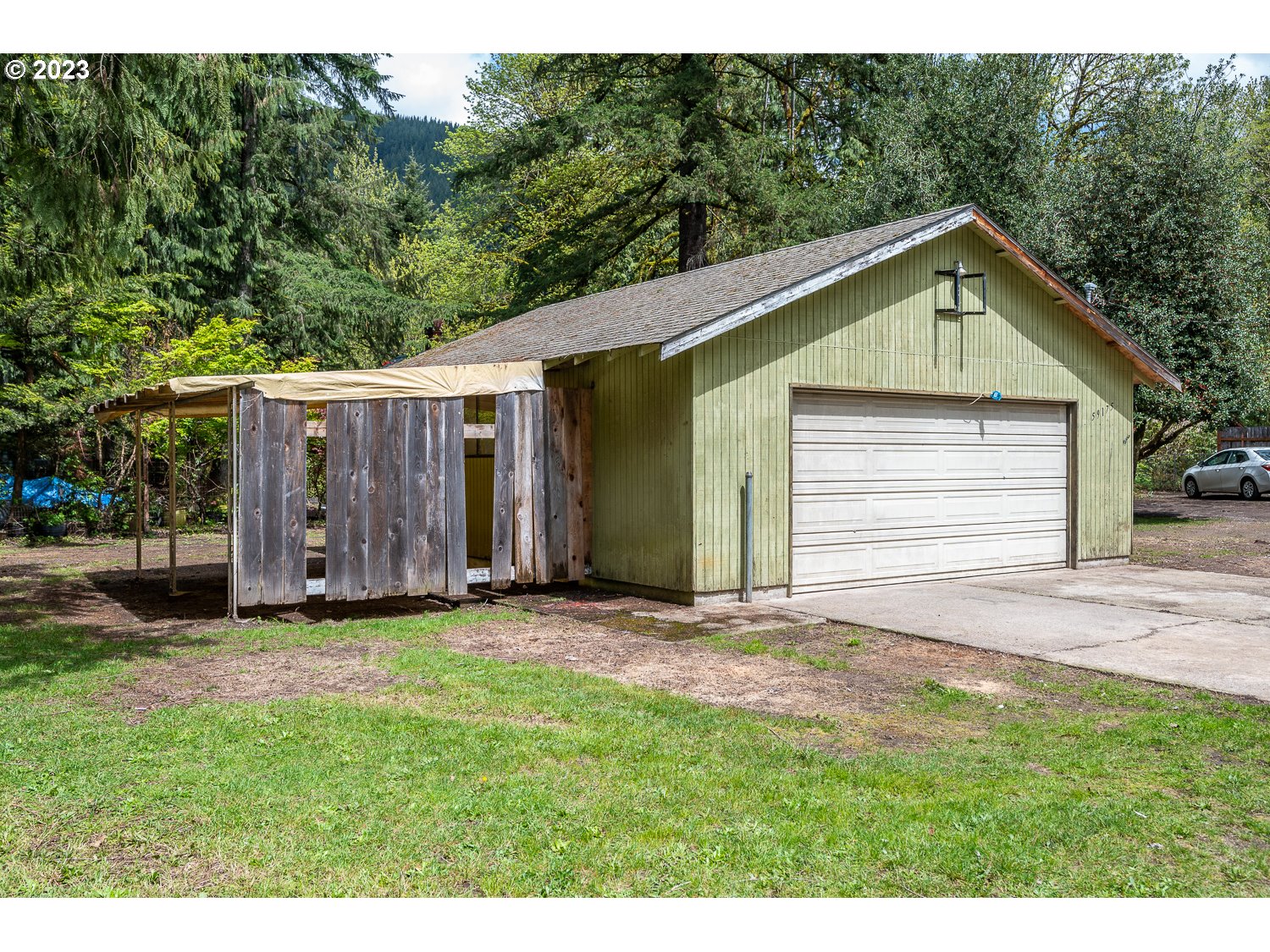 59191 Southeast Chalet Place Sandy, OR 97055 - Photo 23 of 25 a view of front of a house with a yard