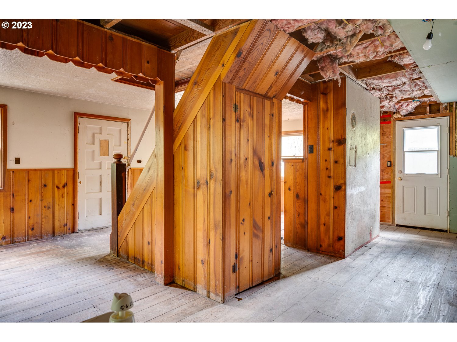 59191 Southeast Chalet Place Sandy, OR 97055 - Photo 6 of 25 a view of a room with wooden floor and stairs