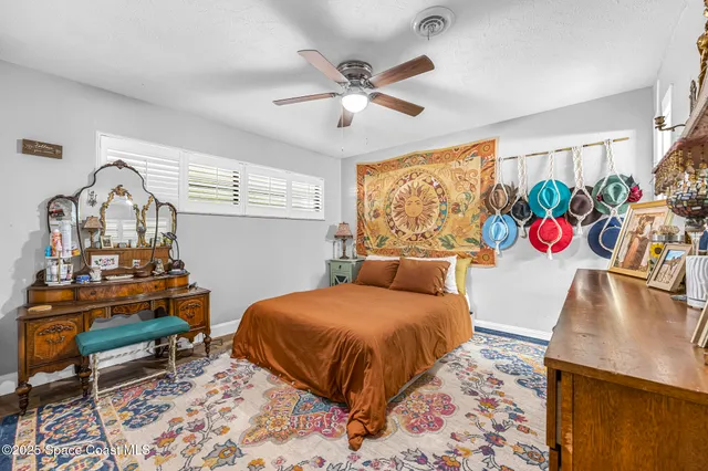 a bedroom with a bed and a table in it