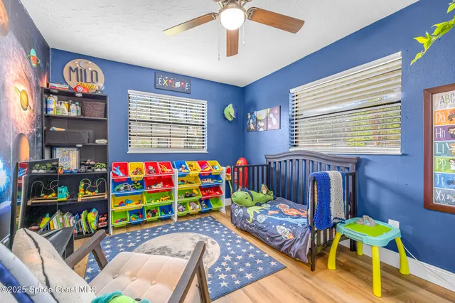 a room with furniture and book shelf